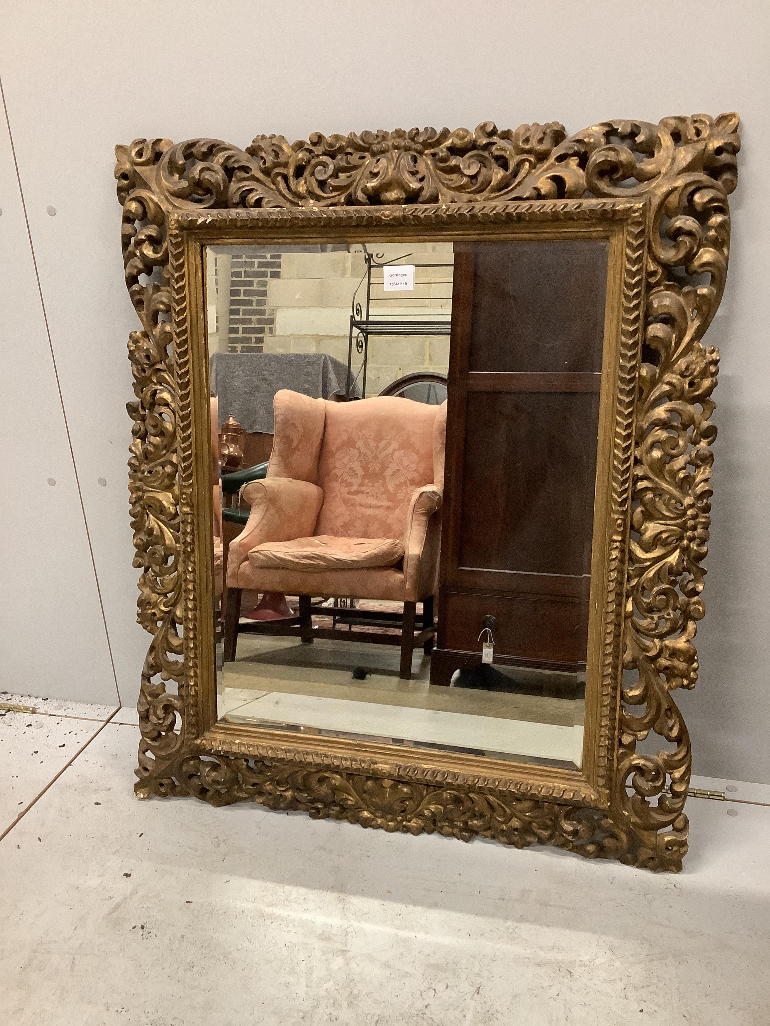 A Florentine style giltwood and composition wall mirror, width 83cm, height 100cm